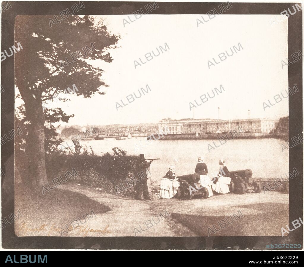 Plymouth from Mt. Edgcumbe. Artist: William Henry Fox Talbot (British, Dorset 1800-1877 Lacock). Dimensions: Image: 16.5 x 20.3 cm (6 1/2 x 8 in.). Date: September 1845.
Talbot was a man of great learning and broad interests, from Egyptology to mathematics, botany, and chemistry. His invention of the negative-positive photographic process, announced to the public in 1839, changed the dissemination of knowledge as had no other since movable type.
This view shows a late summer outing in Plymouth on the property of Talbot's sister Caroline, who had married the Earl of Mount Edgcumbe. The subjects are recorded as two "Miss McDonalds," Talbot's wife Constance, and an unidentified man with the telescope, likely the amateur photographer the Rev. Calvert R. Jones. Across the way is the Royal Navy's new Victualling Office, designed by Sir John Rennie and completed in the 1830s. The block of buildings housed a slaughterhouse, a brewhouse, and an enormous mill and bakery capable of processing 270,000 pounds of flour per week. The self-contained food-and-drink manufacturing complex was commissioned to provide for the needs of the entire British fleet and specifically designed to serve the navy in periods of crisis.