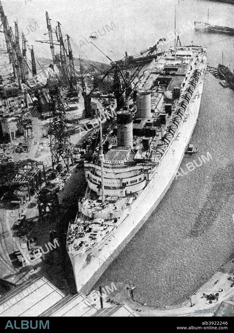 The ocean liner RMS 'Queen Mary', Clydebank, Glasgow, 1934 (1935). Built by John Brown & Co on Clydeside for the Cunard White Star Line, the 81,000 ton Queen Mary was the largest ocean liner in the world when she was launched in 1934. Apart from an interlude as a troopship during World War II, she dominated the transatlantic route, together with her sister, the 'Queen Elizabeth', until she was retired from service in 1967. Since then she has been a hotel and tourist attraction moored at Long Beach, California. From A Concise History of the World, introduction by Sir John AR Marriott (Associated Newspapers Ltd, 1935).