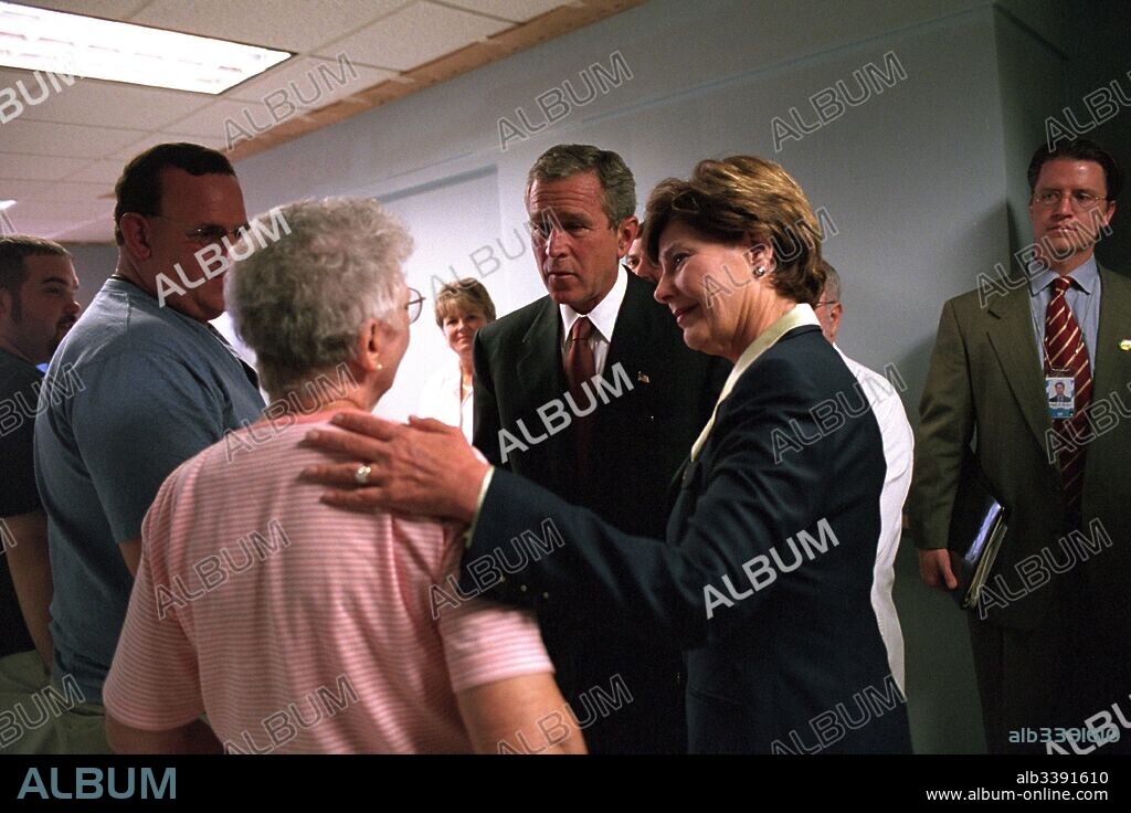 United States President George W Bush and First Lady Laura Bush comfort family members of patients wounded in the September 11 terrorist attack on the Pentagon, at the Washington Hospital Center, Washington, D.C, September 13, 2001. Image courtesy National Archives.