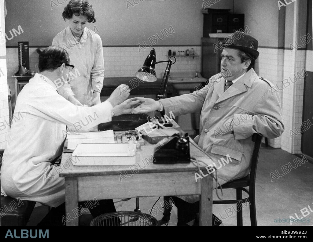 Tony Hancock as a new volunteer blood donor. Left to right Patrick Cargill as the long suffering doctor Ann Marryott and Tony Hancock. 2nd June 1961.