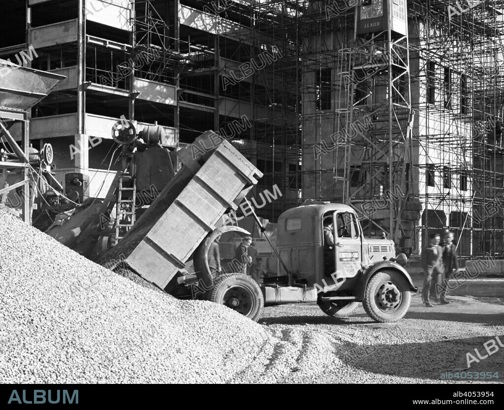 Early 1950s Bedford M Tipper delivering aggregates to a building site, South Yorkshire, July 1954. The site was the National Coal Board's (NCB) state of the art coal preparations plant in the town of Wath upon Dearne near Rotherham.