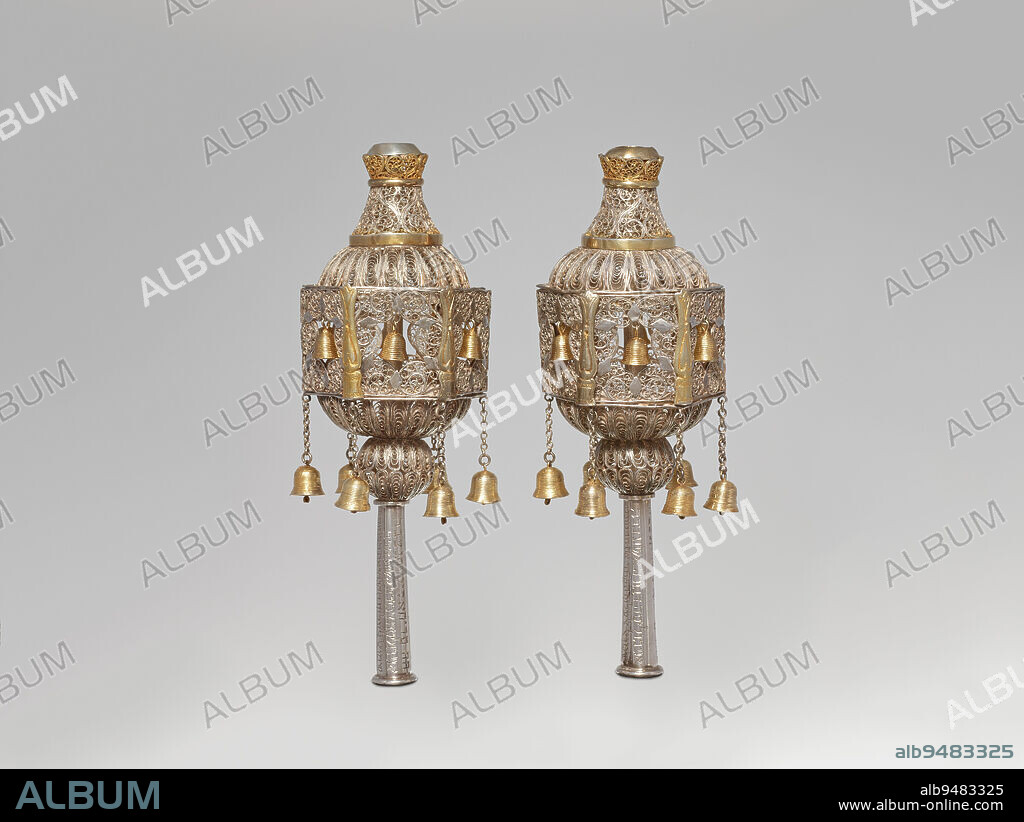Rimmonim (Torah finial) (one of a pair), early 20th century, 9 1/2 x 3 3/8 x 3 3/8 in. (24.1 x 8.6 x 8.6 cm), Silver, gilt silver, Morocco, 20th century, Rimon is Hebrew for pomegranate, a fruit that grows in Israel and other parts of the Middle East and is often eaten on the Jewish New Year. The pomegranate is said to have 613 seeds, the number of commandments found in the Torah. This pair of rimmonim (plural) echo the rounded pomegranate shape while the complex filligree wire provide an organic motif. The staves on which the Torah is rolled are often referred to as Etz Hayim or the 'Tree of Life,' so the rimmonim are thought to represent the fruit of that tree.