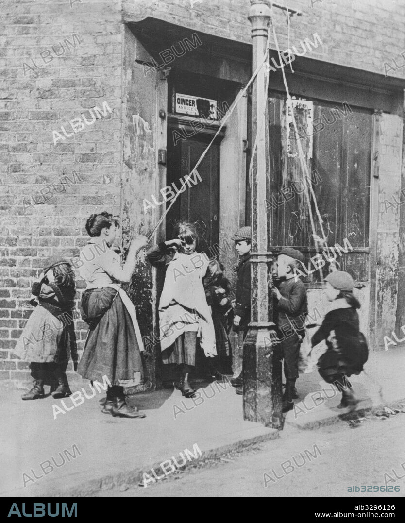 Children Swinging From a Lamp Post, London, Whitechapel, 1892.