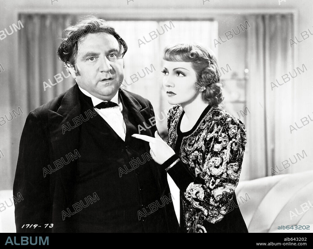 CLAUDETTE COLBERT and HERMAN BING in BLUEBEARD'S EIGHTH WIFE, 1938, directed by ERNST LUBITSCH. Copyright PARAMOUNT PICTURES.