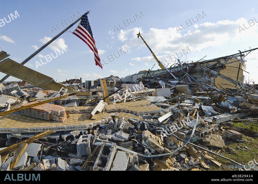 All that remains of the downtown Greensburg, Kansas United States Post Office is a pile of rubble and an American flag. Much of Greensburg was obliterated by winds in excess of 200 miles per hour as a 1.75 mile wide twister struck the small farming community on May 4, 2007. It was the first EF5 tornado recorded in the United States since the National Weather Service switched to the Enhanced Fujita scale on February 1, 2007.