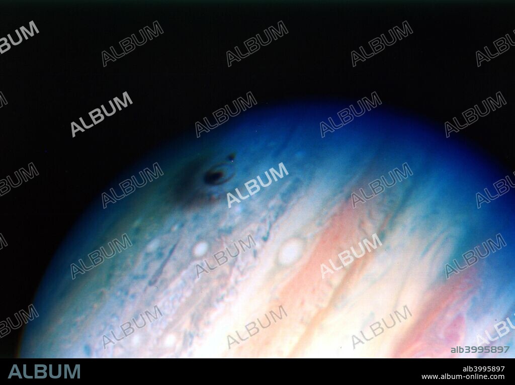 Comet Shoemaker-Levy colliding with Jupiter, 20 July 1994. Between 16 and 22 July 1994, some 20 fragments of Comet Shoemaker-Levy 9 struck the atmosphere of Jupiter, creating disturbances such as the dark smudges visible on the upper part of the planet in this photograph. The largest impact released energy equivalent to an estimated 6 million megatons of TNT and left a mark in the Jovian atmosphere larger than the diameter of the Earth. Astronomers believe that Jupiter plays a vital role in intercepting cosmic debris that might otherwise have reached the inner solar system, enabling the unbroken development of life on Earth to have occurred.