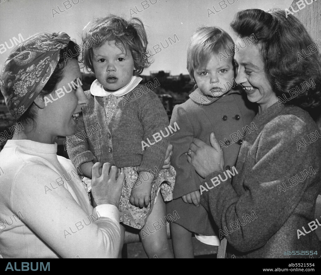Brides Arrive Fro Australia -- Mrs. Russell Pope, (left), with daughter, Carol, two, and Mrs. Britt McBee, (right), with daughter, Judith, one year old, relax aboard the S.S. Monterey as it arrived in San Francisco, Calif., March 4, from Australia with Brides of American Soldiers. Mrs. Pope is bound for 245 South 18th St., Newark, N.J., while Mrs. McBee is going to 5303 as Ashworth St., Bellflower, Calf. March 07, 1946. (Photo by Associated Press Photo).