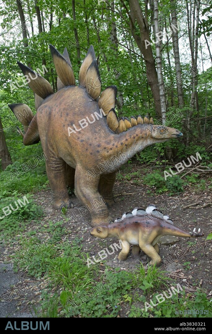 Stegosaurus, a large Jurassic Period herbivorous dinosaur, with baby stegosaurus in Dinosaurier Park, Germany.