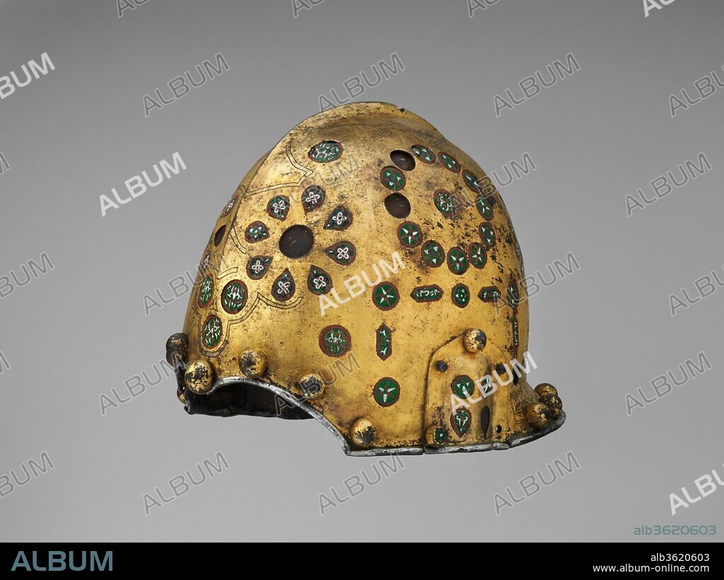 Helmet (Sallet). Culture: Spanish, possibly Granada. Dimensions: H. 7 7/8 in. (20 cm); W. 8 1/8 in. (20.6 cm); D. 10 1/2 in. (26.7 cm); Wt. 3 lb. 12 oz. (1701 g). Date: late 15th-early 16th century.
This helmet is the only known example of armor to survive from the entire Nasrid period in Spain (1230-1492). Traditionally, it is said it belonged to Abd 'Abd Allah Muhammad, known in the West as Boabdil, the last Nasrid king of Granada (reigned 1482-83 and 1487-92) before it was reconquered by the Spanish.
The helmet has the form of a typical Spanish sallet of the late fifteenth century, with cutouts over the eyes inspired by Islamic examples. The decoration, however, is extraordinarily rich and distinctive. The steel is covered entirely in a layer of gold leaf that is finely engraved with geometric and foliate designs; the edges are trimmed with silver. Delicate cloisonné enamels, evocative of Nasrid jewelry, are inset overall, further distinguishing this helmet as one of great rarity, quality, and beauty.