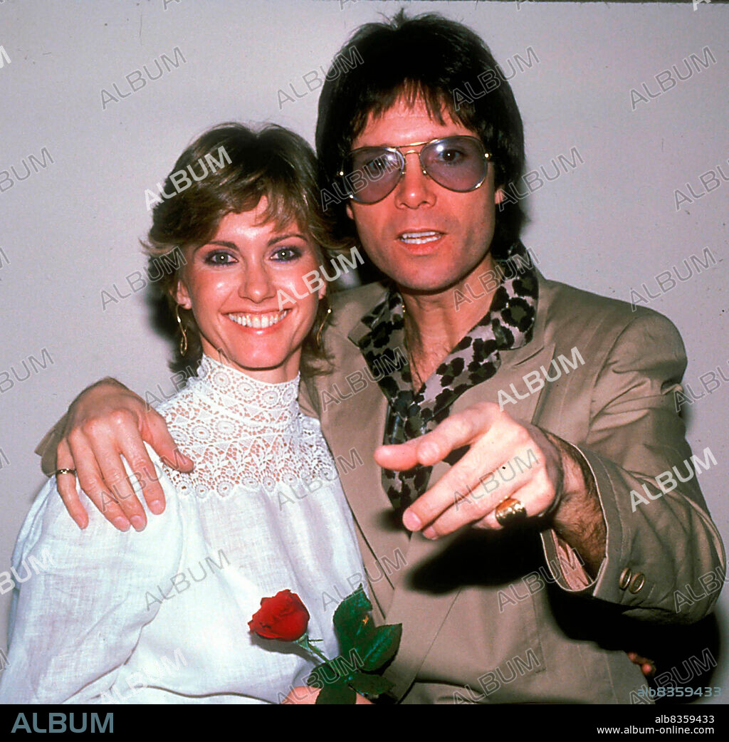 Circa 1983, London, England, United Kingdom: Singers OLIVIA NEWTON JOHN and CLIFF RICHARD. 'Suddenly' is a duet performed by Olivia Newton-John and Cliff Richard from the soundtrack 'Xanadu,' and is the love theme from the 1980 film of the same name. (Credit Image: © Globe Photos via ZUMA Wire).