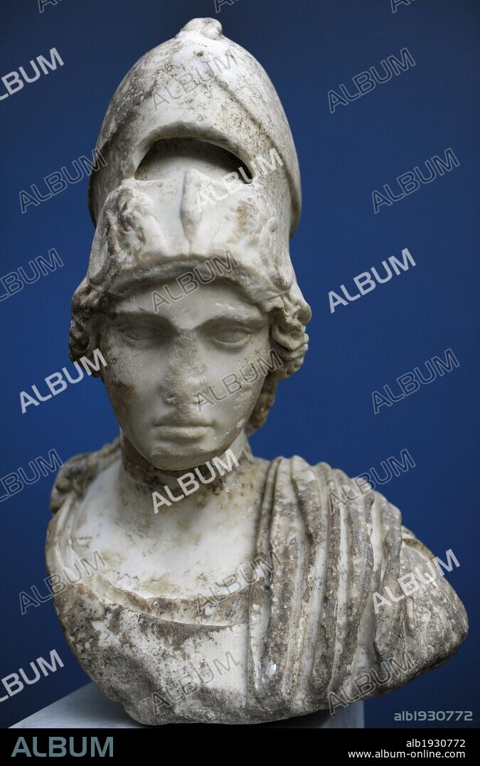 Athena. Rome 2nd century AD. Marble. The helmet is pushed up on her forehead. It was decorated with a sphinx, while the cheek guards have ram's horns in relief. Monsters on helmets and shields were to scare the enemy and protect the bearer against evil. Ny Carlsberg Glyptotek. Copenhagen, Denmark.
