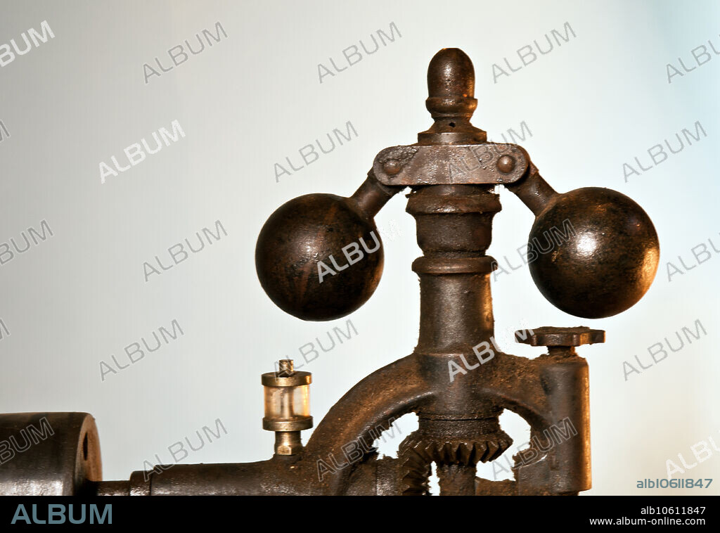 A flywheel governor, also called a centrifugal governor, is a specific type of governor with a feedback system that controls the speed of an engine by regulating the amount of fuel (or working fluid) admitted, so as to maintain a near-constant speed, irrespective of the load or fuel-supply conditions. It uses the principle of proportional control. It was invented in 1788 by James Watt to control his steam engine where it regulates the admission of steam into the cylinder (s). Its widest use was on steam engines during the Steam Age in the 19th century. It is also found on internal combustion engines and variously fuelled turbines, and in some modern striking clocks. As the flywheel increases in speed the two balls swing outward to maintain the constant speed of the flywheel.