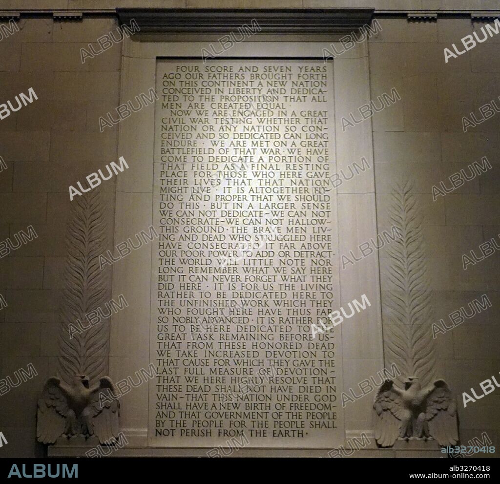 Abraham Lincoln's Gettysburg Address inscribed on a wall of the Lincoln Memorial, an American national monument built to honour the 16th President of the United States, Abraham Lincoln, at night. Dated 21st Century.