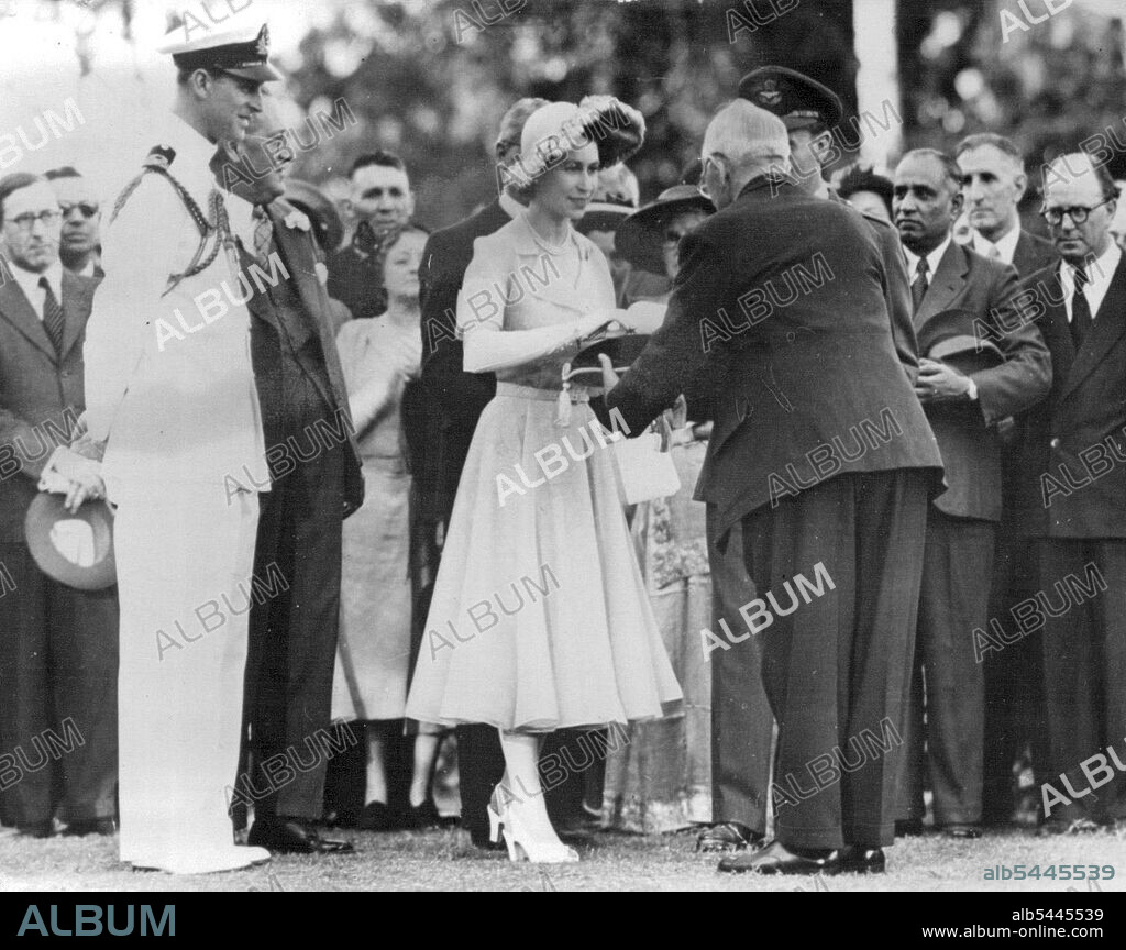Princess Elizabeth And Prince Philip In Nairobi -- At a Garden Party at Government House, Nairobi, Mr. W.K. Horne Speaker of the Kenya Legislative Assembly, presents H.R.H. With the key to Royal Lodge, Sagana, where the Royal couple will spend a four day holiday. The lodge was a wedding gift from the people of Kenya. Princess Elizabeth and Prince Philip received a great welcome when they arrived in Nairobi for the commencement of heir long Commonwealth tour. February 03, 1952. (Photo by Sport and General Press Agency Limited).