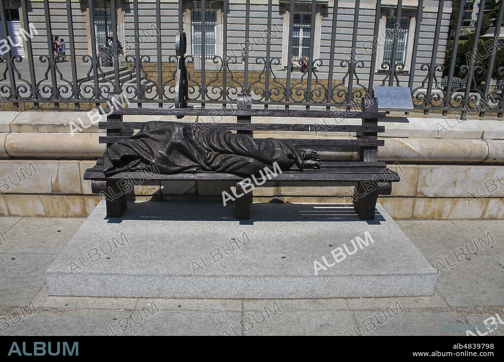 Madrid, Comunidad de Madrid, Spain, Europe.. Calle de Bailén, sculpture of Jesus Homeless, realized by Timothy Schmalz (2016), near the entrance of the Almudena Catedral.