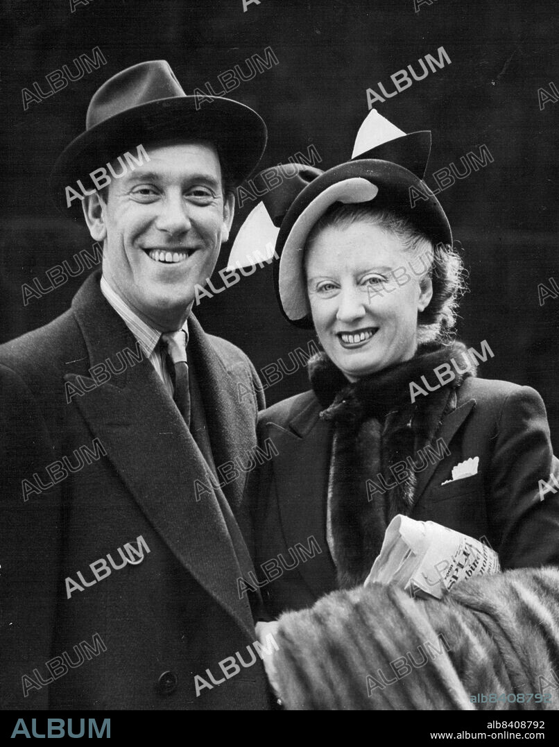 Tommy 'Answers' For Britain -- Accompanied by his wife, 'VI', comedian Tommy Trinder is pictured at Southampton as he left for New York in the Cunard liner 'Queen Elizabeth' Trinder, who describes himself as 'Great Britain's reply to Danny Kaye', is to appear in a show in New York.He intends to return in the 'Queen Mary' on May 9. April 7, 1950. (Photo by Reuterphoto).