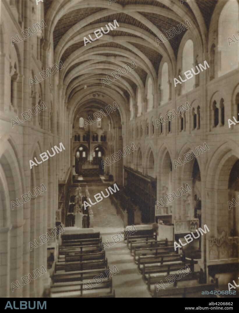 'Buckfast Abbey Church (Interior)', late 19th-early 20th century. Buckfast Abbey forms part of an active Benedictine monastery at Buckfastleigh in Devon. Dedicated to Saint Mary, it was founded in 1018 and run by the Cistercian order from 1147 until it was destroyed under the Dissolution of the Monasteries. In 1882 monks began living there again, and today it is a Benedictine foundation. From Buckfast Abbey, Devon. 12 Specially Selected Real Photo Snapshots. [Valentine & Sons, Ltd., Dundee].
