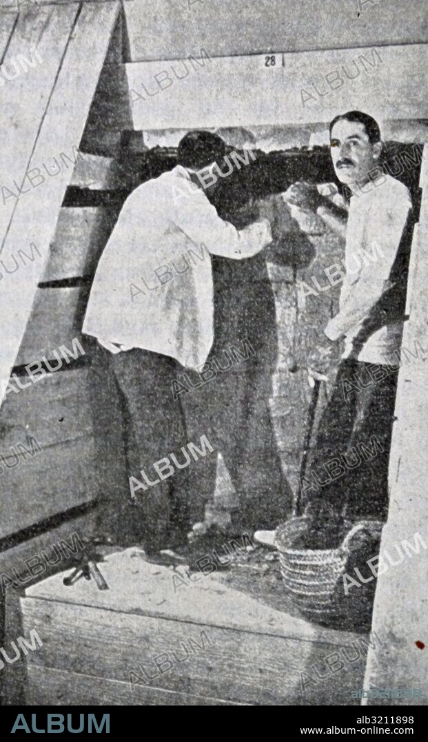 Print showing Howard Carter and George Herbert, 5th Earl of Carnarvon discovering Tutankhamen's tomb. Howard Carter (1874-1939) an English archaeologist and Egyptologist. George Herbert, 5th Earl of Carnarvon (1866-1923) an English aristocrat and financier of the excavation of the tomb. Dated 20th Century.