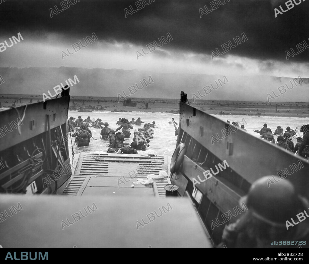 Digitally restored vintage World War II photo of American troops wading ashore on Omaha Beach during the D-Day invasion on June 6, 1944.