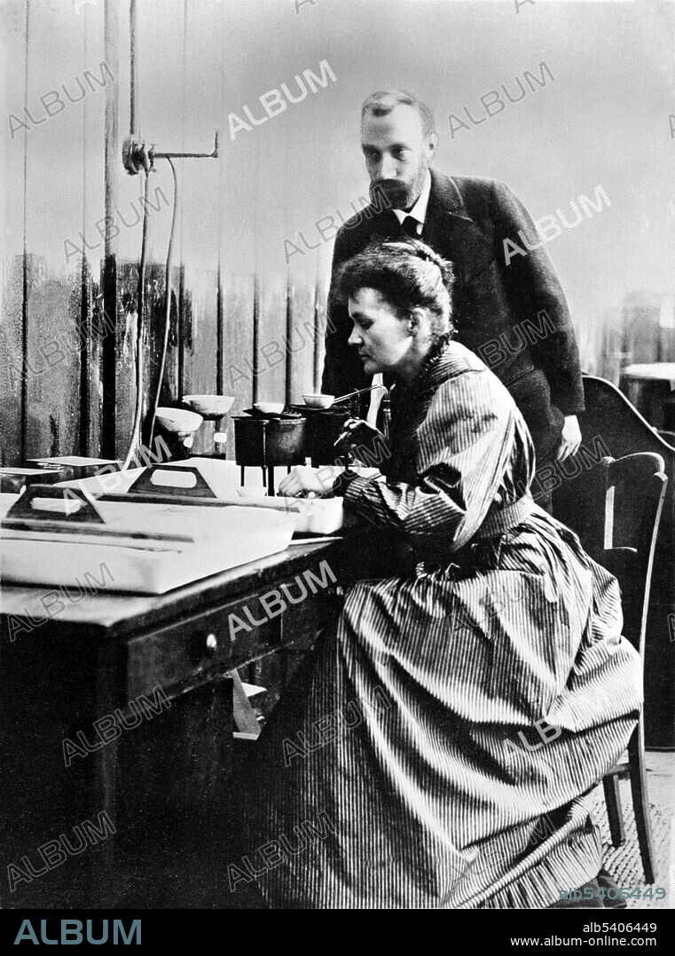 Marie and Pierre Curie in their laboratory in Paris. Pierre Curie was introduced to Maria Sklodowska by a friend and took Maria into his laboratory as his student. He began to regard her as his muse. She refused his initial proposal, but finally agreed to marry him on July 26, 1895. Marie Curie (November 7, 1867 - July 4, 1934) was a Polish-French physicist and chemist. She was the first woman to win a Nobel Prize, the only woman to date to win in two fields, and the only person to win in multiple sciences. Her achievements included a theory of radioactivity (a term that she coined), techniques for isolating radioactive isotopes, and the discovery of two elements, polonium and radium. Pierre Curie (May 15, 1859 -April 19, 1906) was a French physicist, a pioneer in crystallography, magnetism, piezoelectricity and radioactivity, and Nobel laureate. Pierre studied ferromagnetism, paramagnetism, and diamagnetism for his doctoral thesis, and discovered the effect of temperature on paramagnetism which is now known as Curie's law. The material constant in Curie's law is known as the Curie constant. No photographer credited, circa 1900s.