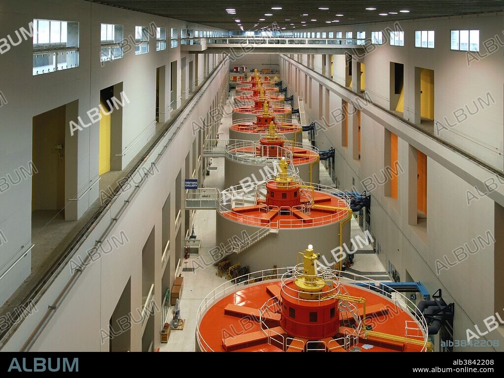 The 2nd Power Station at Bonneville Lock and Dam. Bonneville Dam consists of several structures that together complete a span of the Columbia River on the Oregon/Washington border 146 miles from the Pacific Ocean. The facility's primary functions are electrical power generation and river navigation. The first powerhouse was built in with 10 generators and has a capacity of 526 megawatts. The second powerhouse was built with 8 generators (plus 2 at the fish ladders) which have a capacity of 558 megawatts. The dam was declared a National Historic Landmark in 1987. Image 2 of 2.