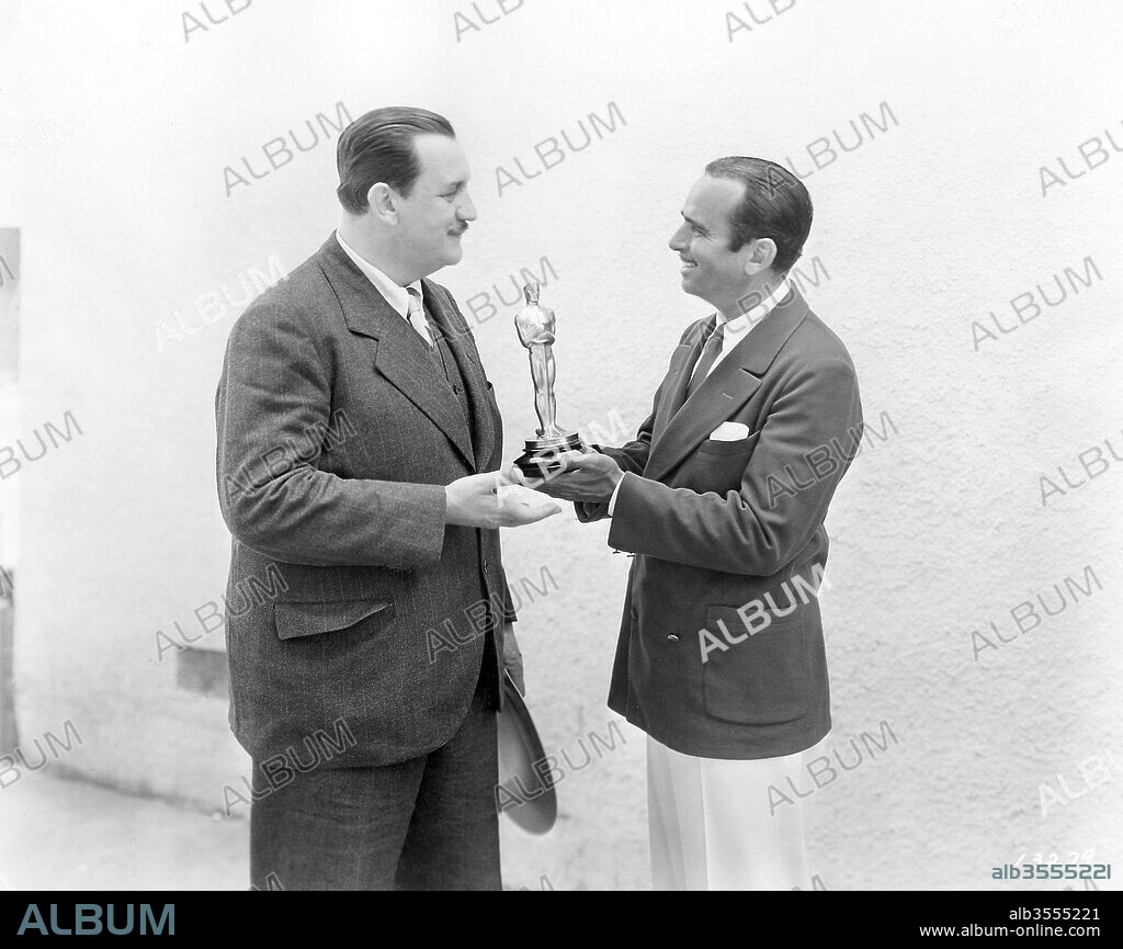 DOUGLAS FAIRBANKS and JOSEPH FARNHAM. The 1st Academy Awards / 1929. 
Joseph Farham receiving his Oscar from presenter Douglas Fairbanks. 1929
