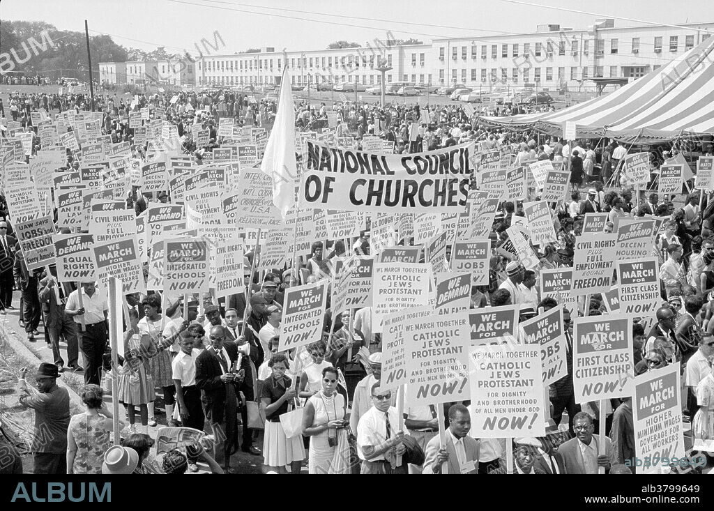 Entitled: "Marchers, signs, and tent." The March on Washington for Jobs and Freedom was one of the largest political rallies for human rights in United States history and called for civil and economic rights for African-Americans. On Wednesday, August 28, 1963. Martin Luther King, Jr., standing in front of the Lincoln Memorial, delivered his historic "I Have a Dream" speech in which he called for an end to racism. The march was organized by a group of civil rights, labor, and religious organizations, under the theme "jobs, and freedom". Estimates of the number of participants varied from 200,000 to 300,000; it is widely accepted that approximately 250,000 people participated in the march. Observers estimated that 75-80% of the marchers were black. The march is credited with helping to pass the Civil Rights Act (1964) and preceded the Selma Voting Rights Movement which led to the passage of the Voting Rights Act (1965). Photographed by Marion S. Trikosko, 1963.