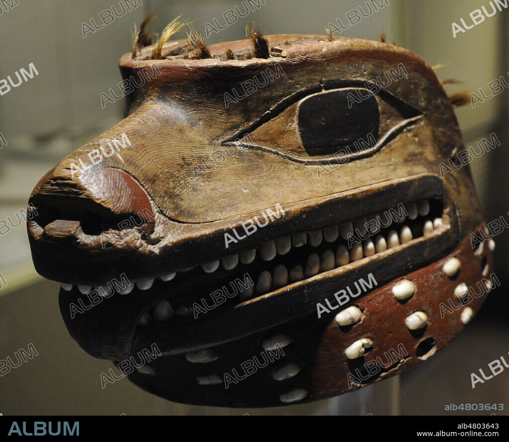 Helmet representing a wolf's head. Animal admired and feared for its strength and violence. Wood, shell and horsehair. Made by Tlingit indigenous people, from the North American Pacific Northwest Coast. 18th century. Museum of the Americas. Madrid, Spain.