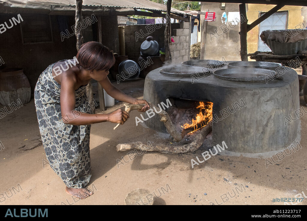 Woman making dolo (drink) in Dapaong, Togo.