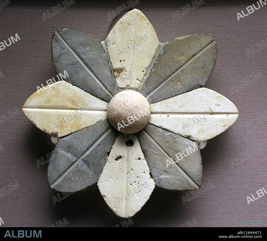 Stone rossete. Used in Eye Temple  decoration. Associated with fertility. Late Uruk period, 3300-3000 BC. Tell Brak. Syria. British Museum.