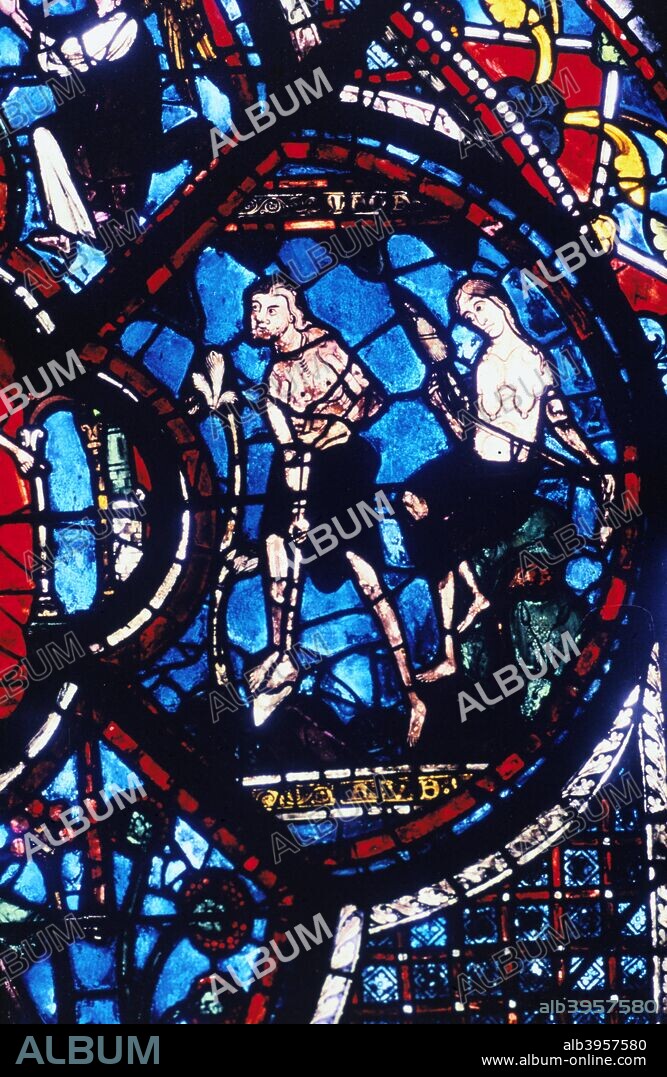 Adam and Eve, stained glass, Chartres Cathedral, France, 1205-1215. Detail from the Good Samaritan and Adam and Eve window in the south aisle.
