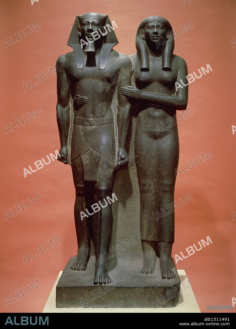 Egyptian civilization, Old Kingdom Dynasty IV. Schist statue depicting Menkaure and his wife Khamerernebty II.