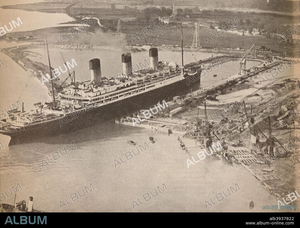 'The White Star Liner Majestic entering the world's largest graving dock at Southampton', c1934, (1935). RMS Majestic was a White Star liner working on the North Atlantic run. Originally the Hamburg America Line liner SS Bismarck from its launch in 1914 it was the largest ship until 1935. SS Bismarck was given as war reparations becoming the SS Majestic. From His Majesty The King 1910-1935. [Associated Newspapers Ltd., London, 1935].