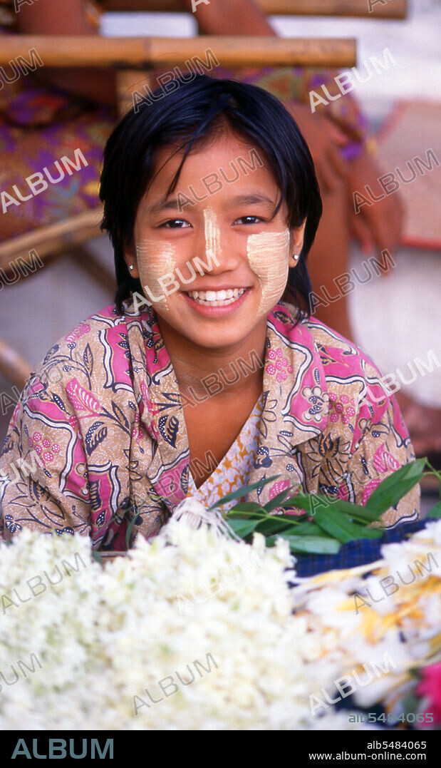 Thanaka (also spelt thanakha) is a yellowish-white cosmetic paste made from ground bark. It is a distinctive feature of Myanmar (formerly Burma) seen commonly applied to the face and sometimes the arms of women and girls and to a lesser extent men and boys. The use of thanaka has also spread to neighboring countries including Thailand. The earliest literary reference to thanaka is in a 14th century poem written by Mon-speaking King Razadarit's consort. Mentions of thanaka also exist in the 15th century literary works of Burmese monk-poet Shin Maharatthasara (1486-1529). The wood of several trees may be used to produce thanaka cream; these trees grow abundantly in central Myanmar. They include principally Murraya spp. (thanaka), but also Limonia acidissima (theethee or wood apple). The two most popular are Shwebo thanaka from Sagaing Division and Shinmadaung thanaka from Magwe Division. A more recent contender sold as a paste is Taunggyi Maukme thanaka from southern Shan State. Thanaka trees are perennials, and a tree must be at least 35 years old before it is considered mature enough to yield good-quality cuttings. Thanaka in its natural state is sold as small logs individually or in bundles, but nowadays also available as a paste or in powder form. Thanaka cream has been used by Burmese women for over 2000 years. It has a fragrant scent somewhat similar to sandalwood. The creamy paste is applied to the face in attractive designs, the most common form being a circular patch on each cheek, sometimes made stripey with the fingers known as thanaka be gya, or patterned in the shape of a leaf, often also highlighting the bridge of the nose with it at the same time. It may be applied from head to toe (thanaka chi zoun gaung zoun). Apart from cosmetic beauty, thanaka also gives a cooling sensation and provides protection from sunburn. It is believed to help remove acne and promote smooth skin. It is also an anti-fungal.