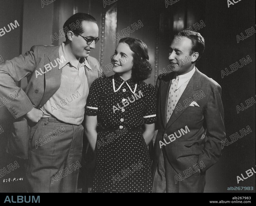 DEANNA DURBIN, HENRY KOSTER and JOE PASTERNAK in ONE HUNDRED MEN AND A GIRL, 1937, directed by HENRY KOSTER. Copyright UNIVERSAL PICTURES.