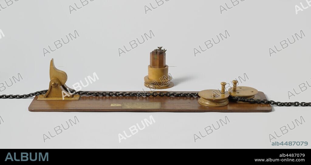 Model of a Stopper and Bitts, Model of a safe stopper with chain, on a floorboard, with a separate beting. At the end of the floorboard the chain runs through a normal pincher. The stopper consists of a set of disks mounted in the floor at the other end, one of which rotates around an eccentric shaft, the chain runs around the hard drive, forward around the eccentric drive and back again. The tension on the chain pulls the eccentric disc backwards so that the chain is clamped between the two discs. There is a disk around the base of the loose octagonal bite so that it can replace the hard disk on the floorboard., Rijkswerf Amsterdam, 1854, wood (plant material), brass (alloy), iron (metal), stopper: h 17.5 cm × w 118 cm × d 30.3 cm bitts: h 20 cm × w 16.9 cm × d 16.5 cm.