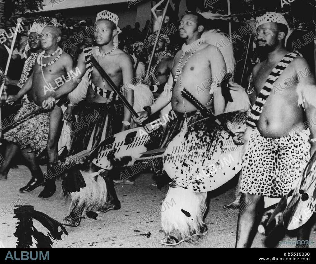 Paramount Zulu Chief Honours Tshaka -- Cyprian Kabhekuzulu (second) from right Paramount chief of all the Zulus is shows here in full traditional dress members of the Royal household during ritual tribal ceremonies at the tomb of Tshaka. founder of the Zulu nation, September 23 at Stanger, Natal, site of Tshaka's Kraal.This was one of the rare occasions on which the chief has abandoned western attire.During the ceremonies a marble monument to Tshaka was unveiled. October 1, 1954. (Photo by Associated Press Photo).