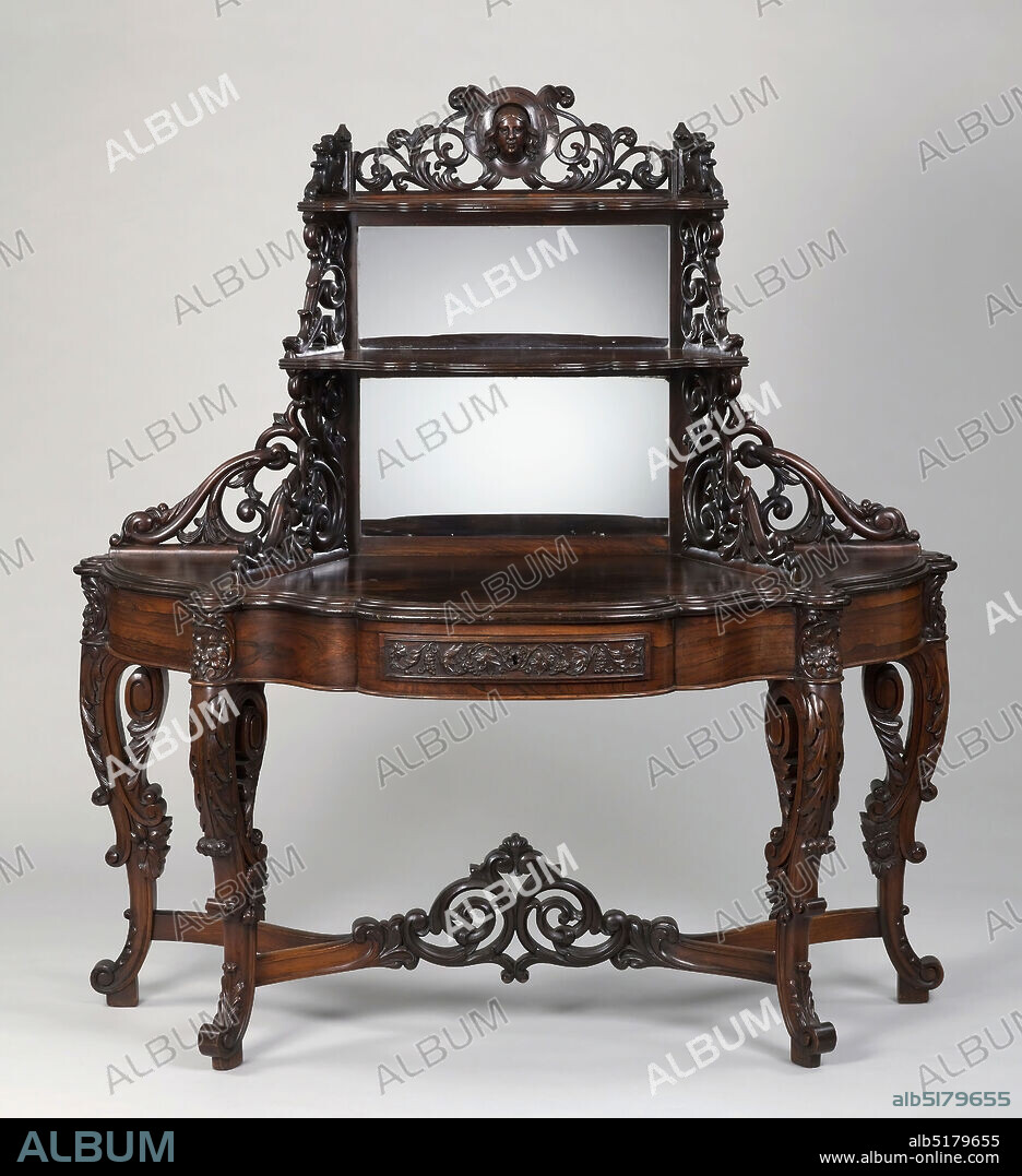 Étagère, Rosewood, maple, glass mirror, brass, Table is oval half-round in shape, supported on four scroll legs. Curved stretcher with openwork crest. Shaped plinth surmounted by two shelves of graduated size with shaped profile edges, supported on pierced fretwork brackets. Back of two upper shelves fitted with mirror glass. Top of second shelf surmounted by scrollwork with central escutcheon and high relief female head. Finial above head missing. Central drawer on table front, with front panel carved with arabesques and grape clusters. Interior of drawer of maple, with rectangular brass locking device., New York, New York, USA, ca. 1855, furniture, Decorative Arts, Étagère.