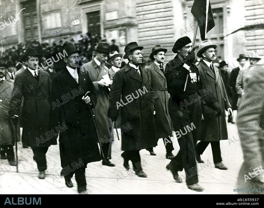 The first Fascist Congress, Rome, 1919. Benito Mussolini, Italian dictator, is in the centre behind the man carrying the banner.