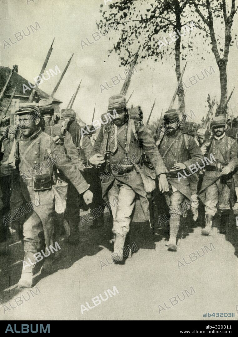 French troops on the march, First World War, 1914-1918, (c1920). '"The Most Rapid Marchers in Europe": French infantrymen in their new "tricolour grey" uniform...long reputed to be the most rapid marchers in Europe,...here shown on their way to the firing-line, with their long coats buttoned back to give freedom of movement to their legs.' From "The Great World War - A History" Volume IV, edited by Frank A Mumby. [The Gresham Publishing Company Ltd, London, c1920].