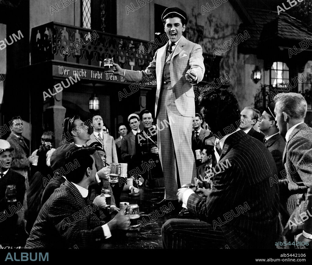 Drinking Song....Edmund Purdom and the students of Heidelberg in a musical presentation from M-G-M's "The Student Prince". "The Student Prince", filmed in Cinema Scope and in color, stars Ann Blyth, Purdom, John Ericson, Louis Calhern and the singing voice of Mario Lanza. Richard Thorpe directed and Joe Pasternak produced from the script by William Ludwig and Sonya Levien. July 26, 1954.
