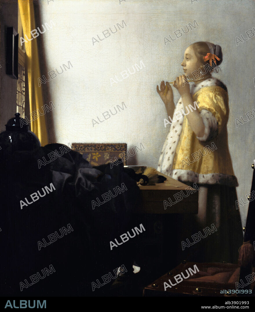JAN VERMEER. Young Woman with a Pearl Necklace. Date/Period: Ca. 1662. Painting. Oil on canvas. Height: 55 cm (21.6 in); Width: 45 cm (17.7 in).