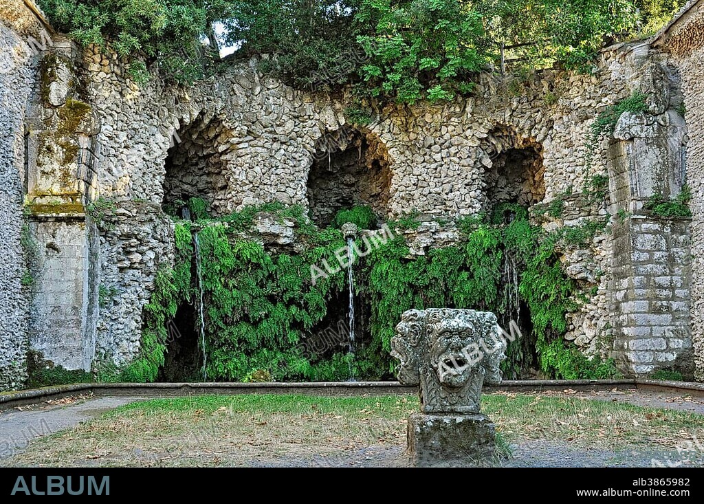 Stone mask with four heads at the grotto of the water source, Fontana del Diluvio, flood fountain, garden of Villa Lante, Bagnaia, Lazio, Italy, Europe.