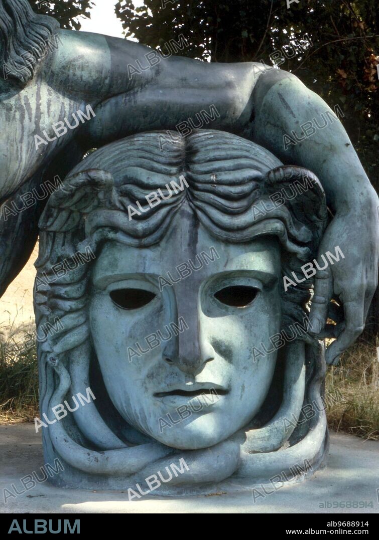 DEMONS - MEDUSA. The decapitated head of Gorgon Medusa, on which Leonardo da Vinci is portrayed reclining his left arm. Giant statue on the bank of the Loire, at Amboise, France.