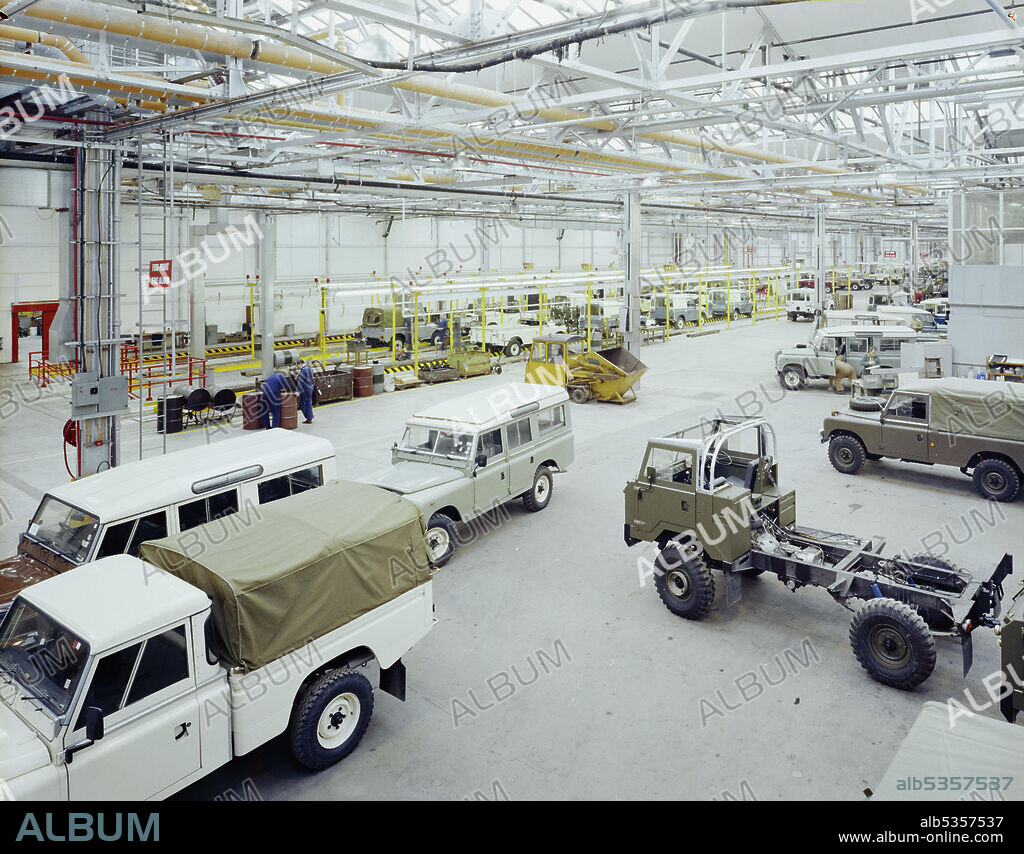 JOHN LAING PLC. A view of vehicles being manufactured inside the Land Rover factory in Solihull after refurbishment work at the site. A Laing Midlands Region team started work in December 1981 on a contract of refurbishments to part of the Land Rover Factory in Solihull. Work in two factory blocks was carried out and a wide range of new facilities had to be installed including inspection areas, rolling roads, rectification areas for paint and a waxing area. During the refurbishment programme, building entrances were enlarged to allow access for large plant, roof steelwork was strengthened and a bailey bridge was constructed between the two buildings.