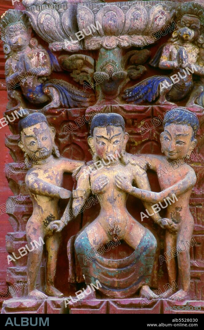 Immediately west of the Royal Palace entrance gate, the rusty-red Jagannath Temple, built in 1653 by Mahendra Malla, enshrines a figure of the Chaturmurti Vishnu, the 'Four-Figured Vishnu'. This particular form of Vishnu is also called Jagannath, 'Lord of the World', and the etymological root of the English word 'juggernaut'. The main shrine in the Jagannath Temple is accessible only to priests. The large struts under the roof are covered with erotic carvings. These carvings, which are fairly crudely executed, occupy the base of larger and more refined carvings representing gods and goddesses. The latter are dressed in regal finery, adorned with crowns and jewellery, and wear serene expressions on their faces.