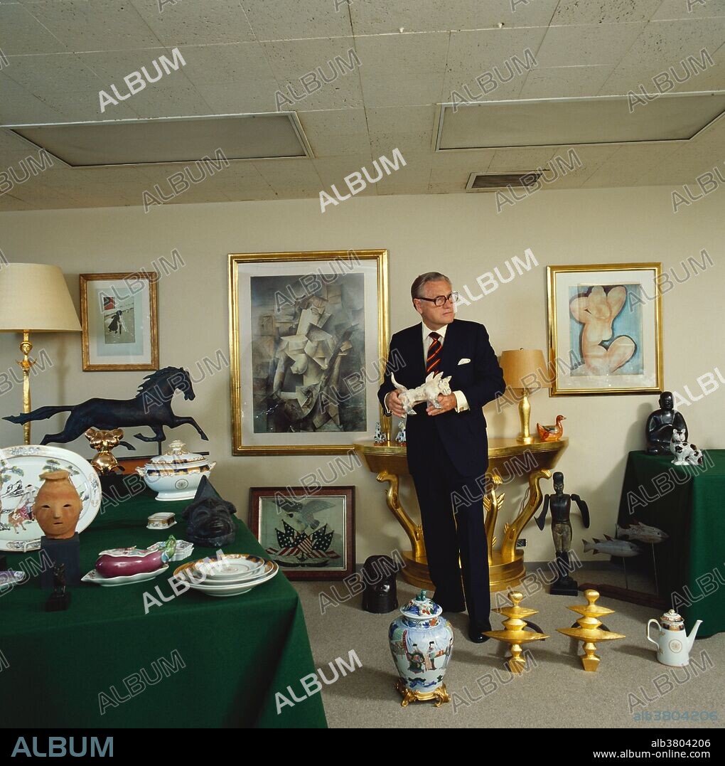 Nelson Rockefeller in his New York City apartment amidst reproductions of art works from his private collection. His firm, the Nelson Rockefeller Collections, sells these replicas to the public. Prices for the copies range from $175 to $7500. Photographed in 1978.