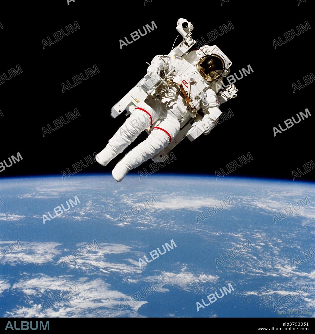 Astronaut Bruce McCandless II, STS 41-B mission specialist, participates in a historical spacewalk on February 7th, 1984. He is pictured a few meters away from the cabin of the Earth-orbiting Space Shuttle Challenger. This spacewalk represented the first use of a nitrogen-propelled, hand-controlled device called the Manned Maneuvering Unit (MMU), which allows for much greater mobility than that afforded previous space walkers who had to use restrictive tethers. McCandless, who helped design the MMU, was the first person to fly it, thus becoming the first "human satellite" in orbit around the Earth. Mission 41-B was the 10th space shuttle flight which launched from Kennedy Space Center on February 3rd, 1984 and returned on February 12th.