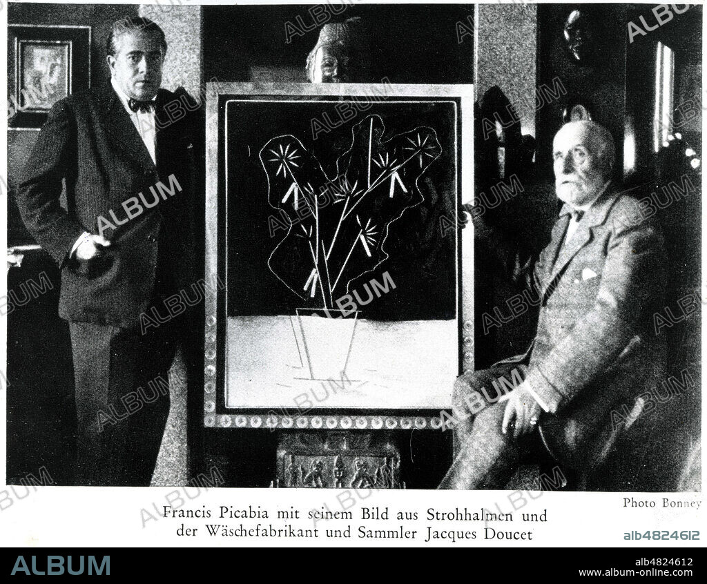 Francis PICABIA (1879-1953) montrant une de ses oeuvres, aux cotes de Jacques DOUCET (1853-1929). Photographie par Bonney tiree de la revue artistique Red vers 1925. annees 20. Credit : Collection KHARBINE-TAPABOR.