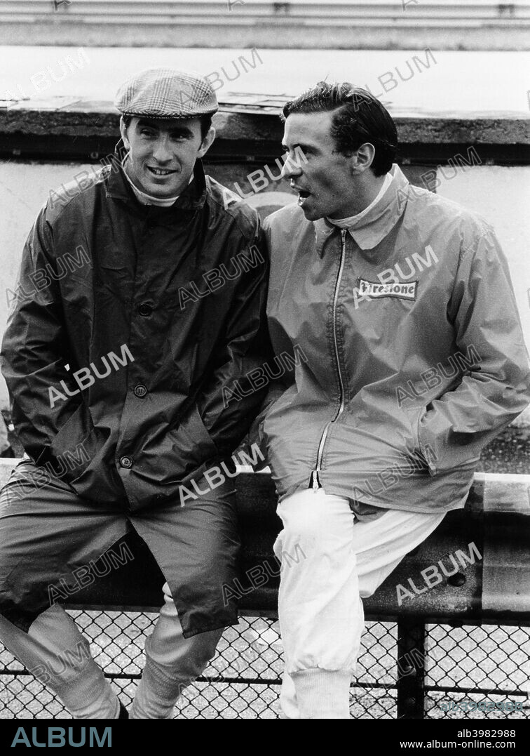 Jackie Stewart on the left, and Jim Clark, 1967. Chatting at the side of the track, at the Italian Grand Prix at Monza. Stewart's career lasted until 1973. He won a then record 27 Grands Prix, as well as three World Drivers' Championships, in 1969, 1971 and 1973. Clark won the Formula 1 World Championship twice, in 1963 and 1965. He drove exclusively for Lotus until his death in a Formula 2 race in Hockenheim, Germany in 1968.